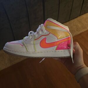 pink, orange, and yellow nike air jordan’s size 4.5